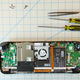 A screenshot of the Steam Deck's internals, with tools (like screwdrivers) above the chassis.